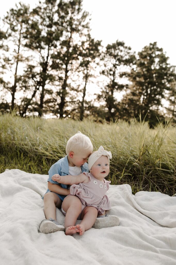 brother giving his sister a kiss
