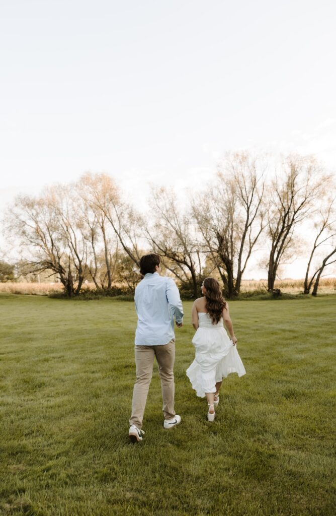 engagement photos and the couple are chasing each other