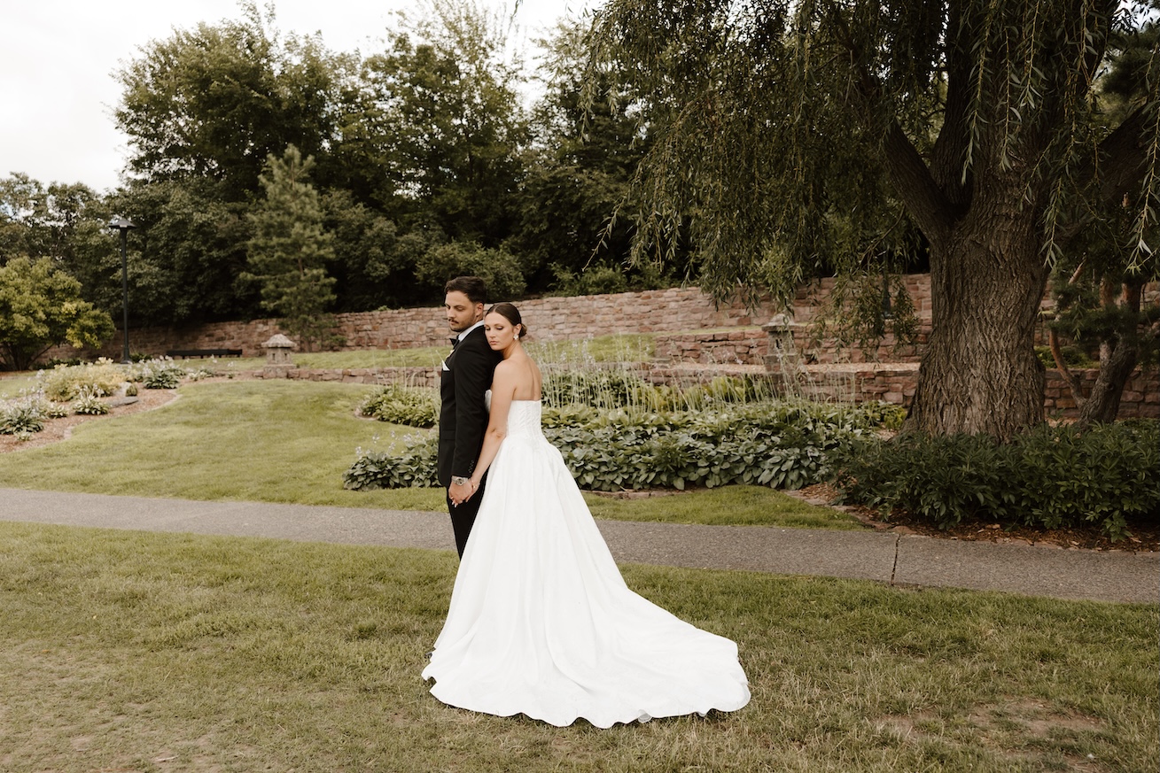 bride and groom on their wedding day posing for the photographer