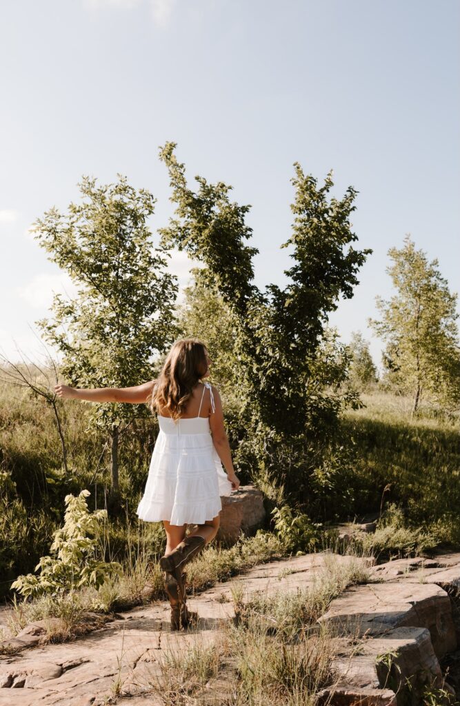 senior posing for a senior photographer