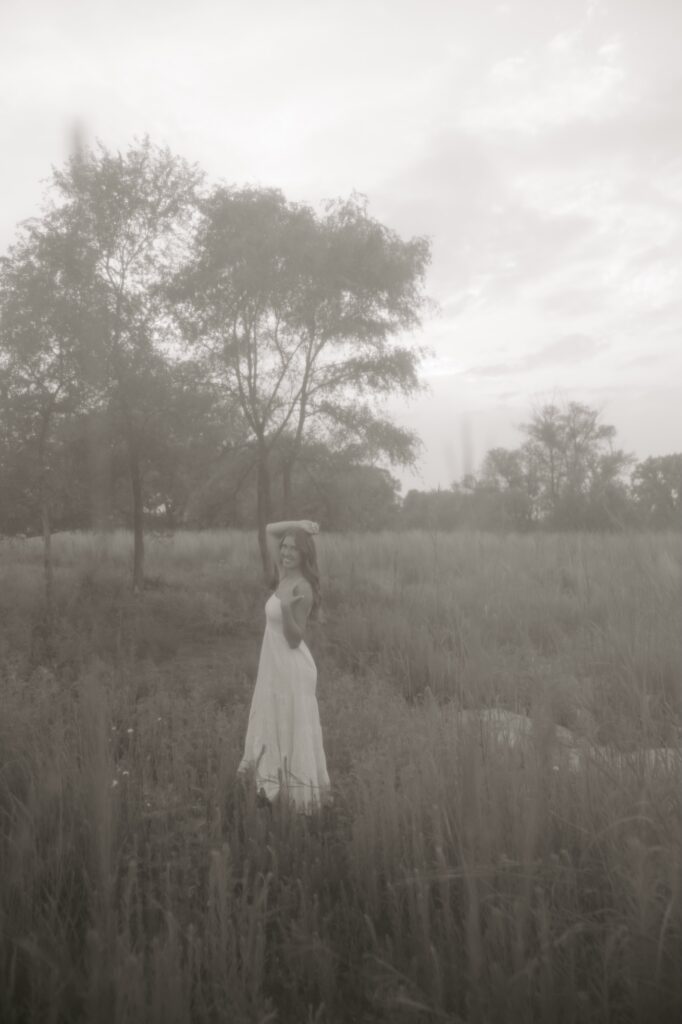 senior posing for a senior photographer