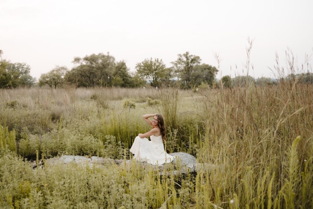 senior posing for a senior photographer